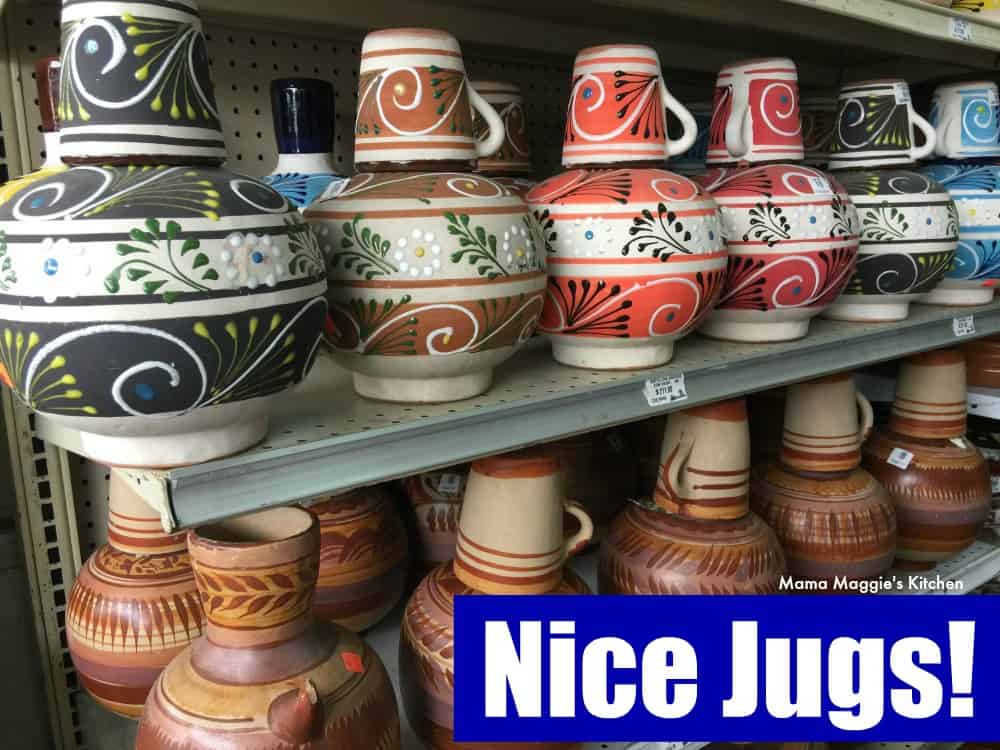 A picture of decorative Mexican jugs on display at a store.