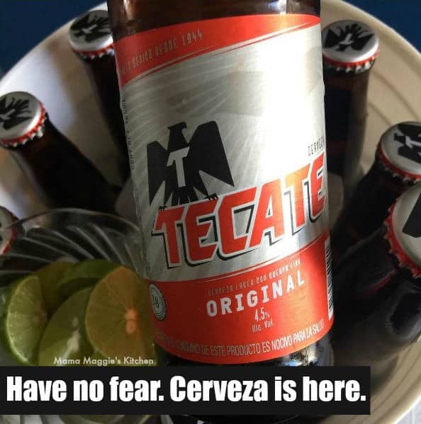 A glass bottle of Tecate beer. 
