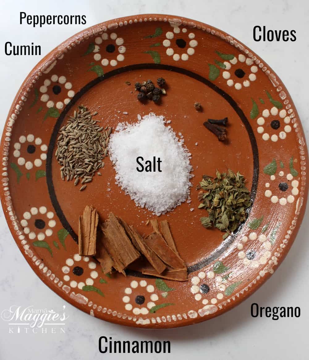 The spices for Yucatan-Style Turkey laid out and laid on a decorative clay plate.