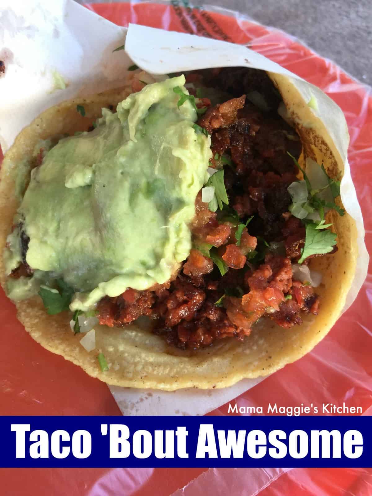 A taco topped with guacamole