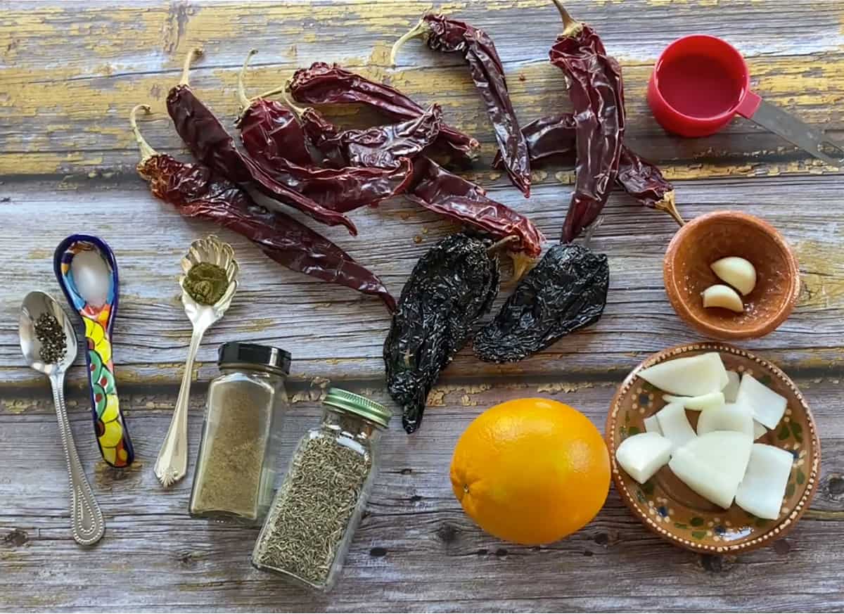 All the ingredients for the sauce laid out on a wooden table.