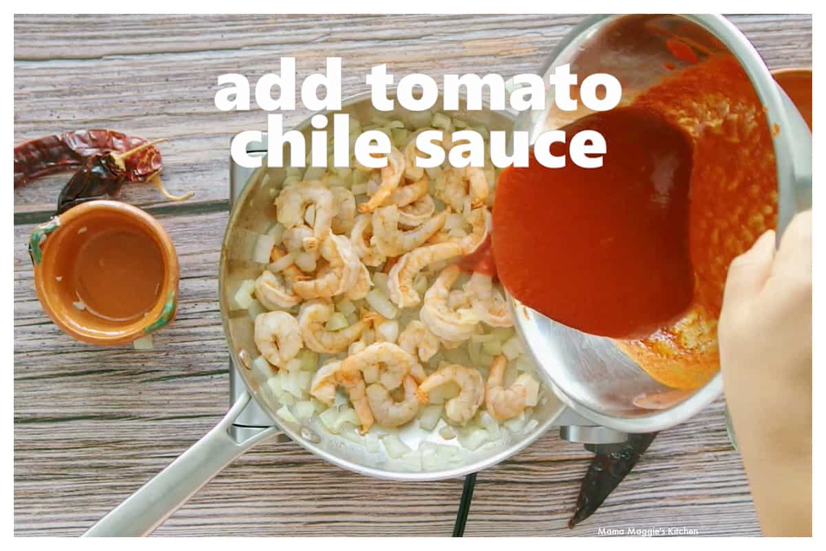 Tomato chile sauce being added to a skillet with cooked shrimp.