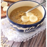 A bowl of Avena (or Mexican oatmeal) topped with sliced bananas.