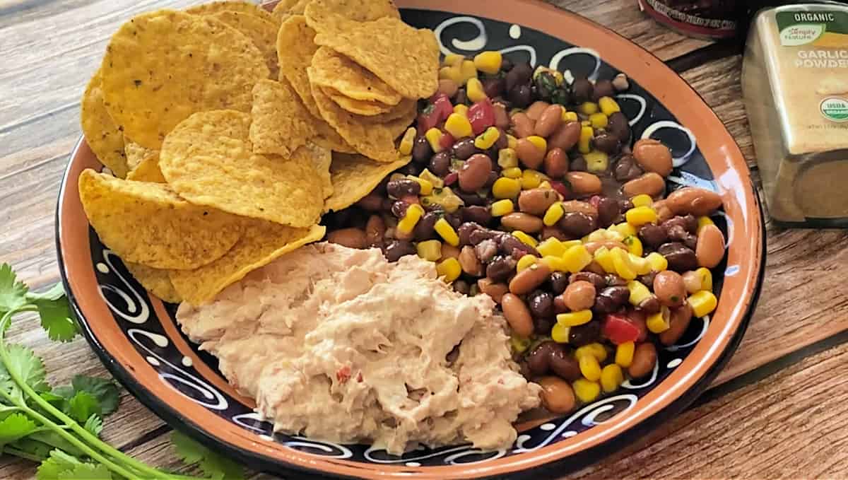 A plate with bean salad and creamy chipotle tuna salad.