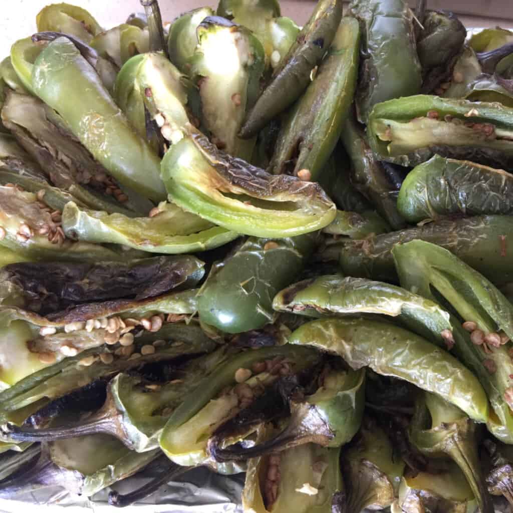 Chiles Toreados piled high on a silver platter.