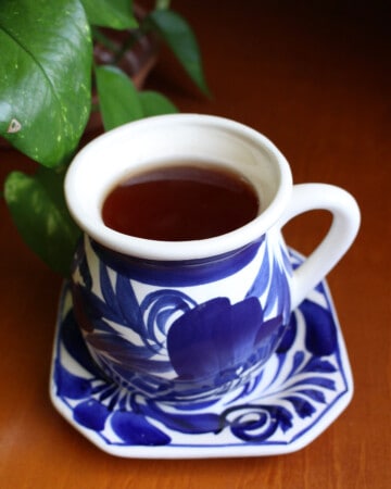 Anti inflammatory tea in a decorative blue mug.