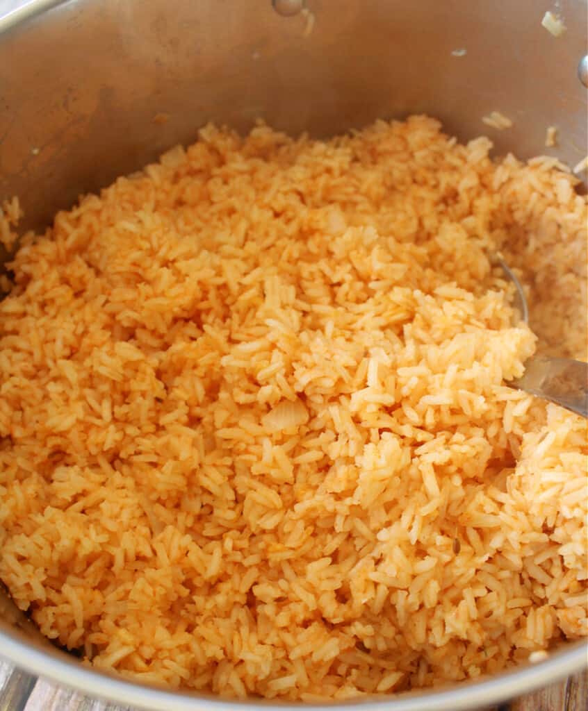Cooked Mexican rice in a stock pot.
