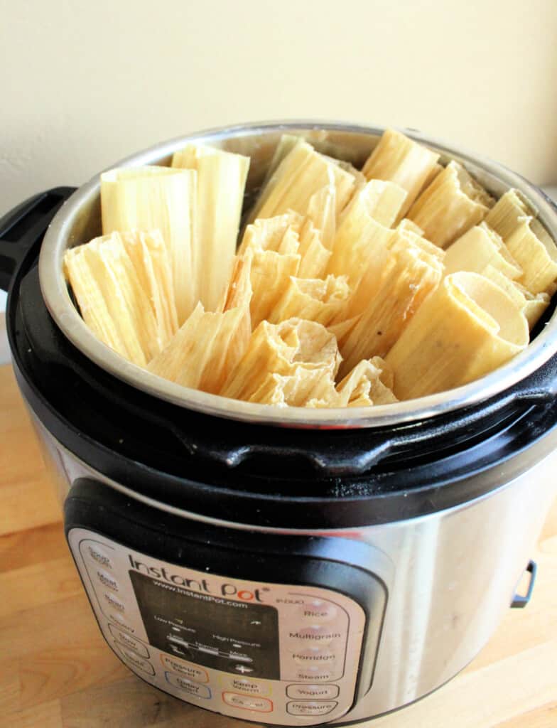 Tamales assembled and stacked in an instant pot.