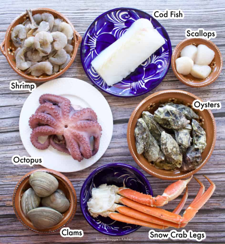 Seven different types of seafood laid out and labeled.