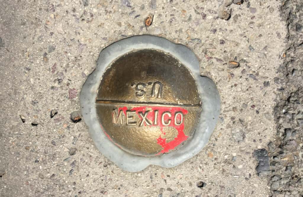 A picture of the border marker that separates the US from Mexico.