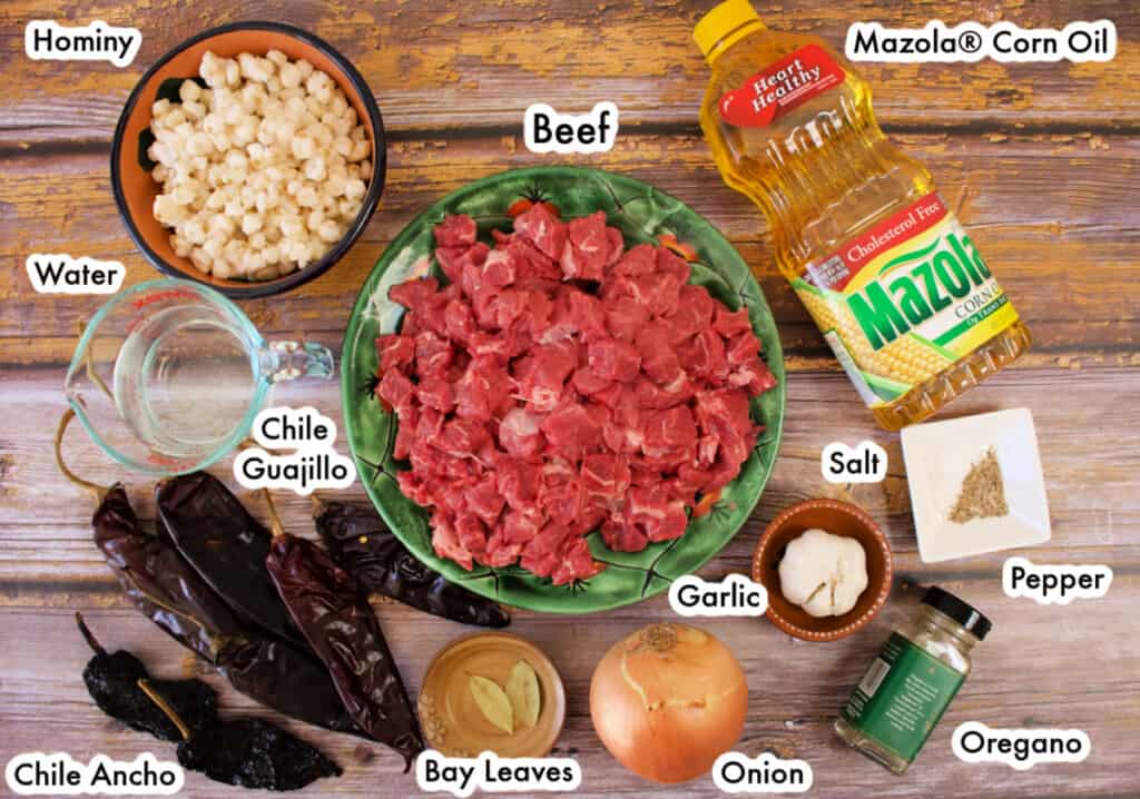 The ingredients needed to make the beef pozole laid out and labeled.