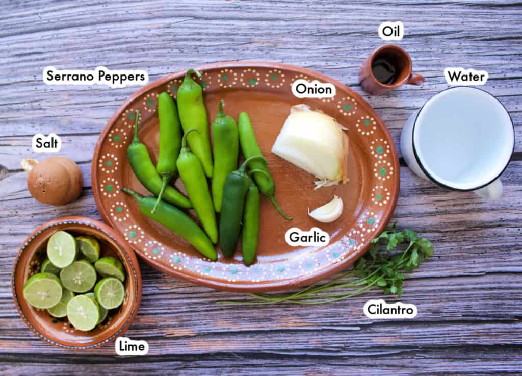The ingredients needed to make the creamy taqueria-style salsa serrano laid out and labeled.
