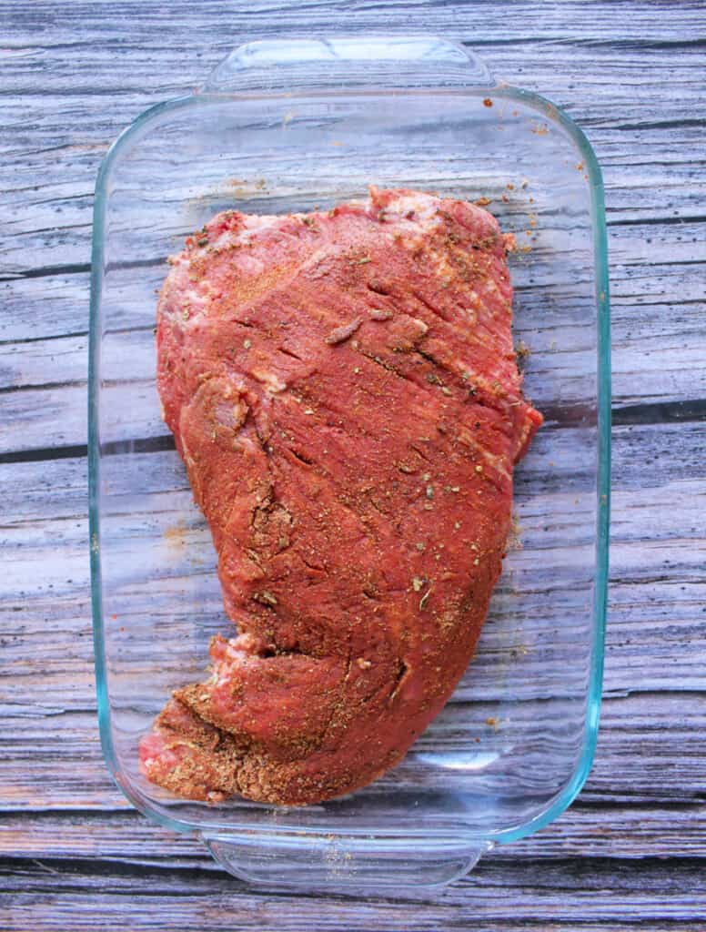 A raw tri-tip covered with the Mexican spice rub.