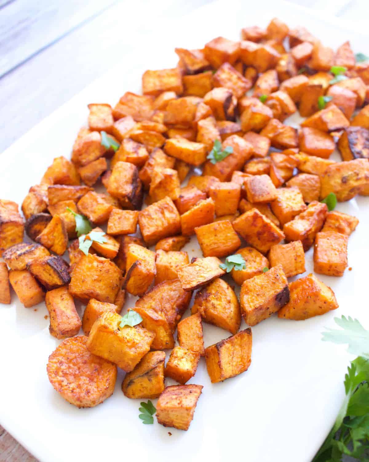 Roasted Mexican Sweet Potatoes are crisp on the outside and tender on the inside. Sure to be everyone’s favorite side dish for dinner or holidays!