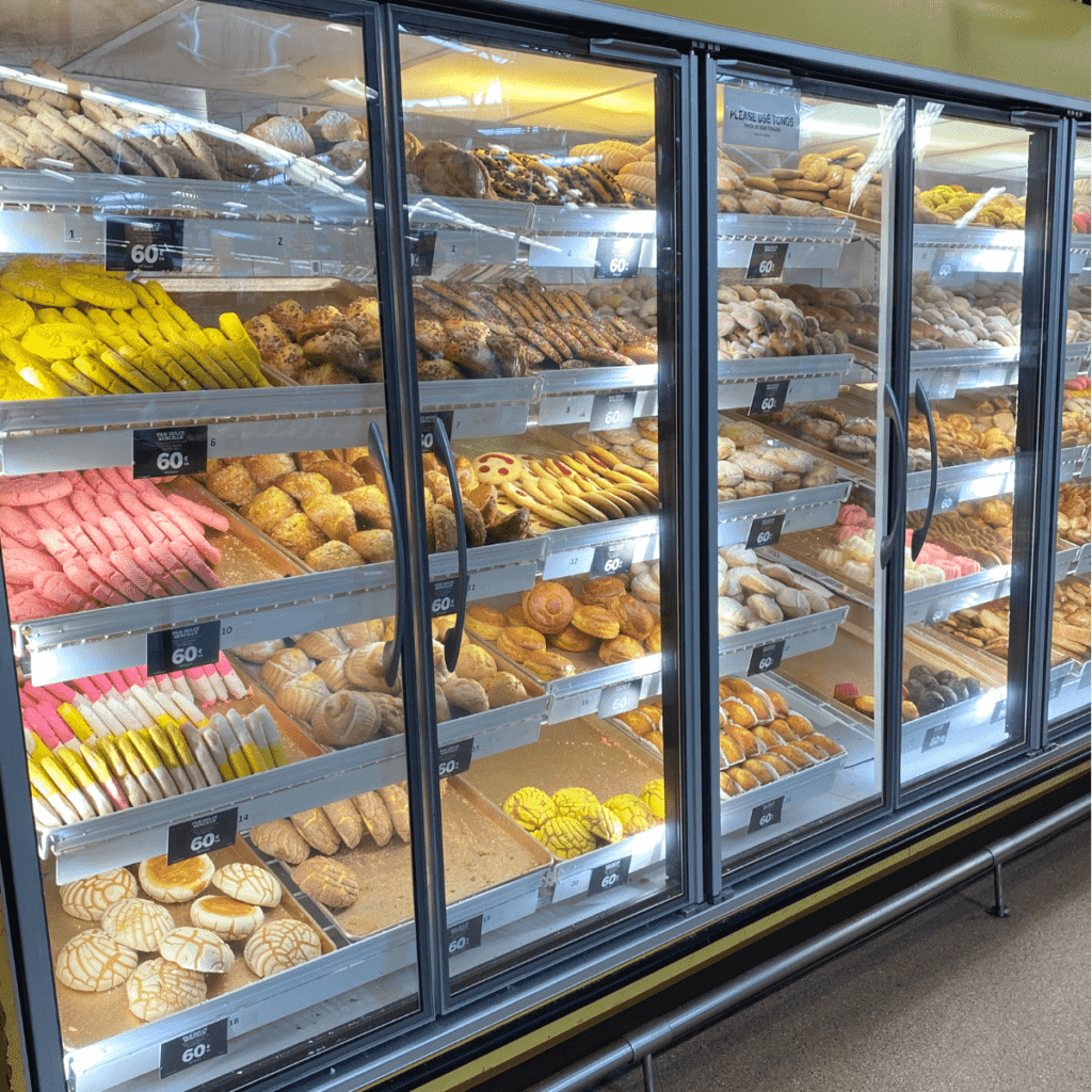A display at a Mexican bakery (or panaderia) showcasing all the different types of sweet breads.
