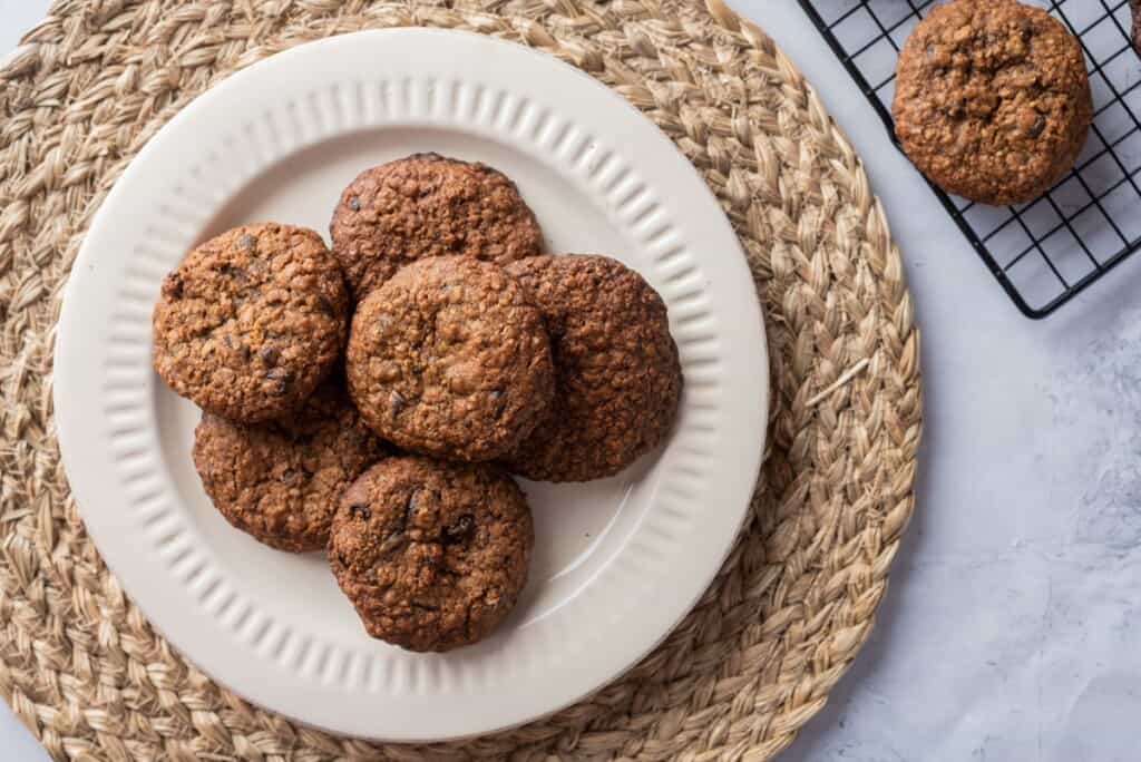 Oatmeal cookies served on a large white plate.