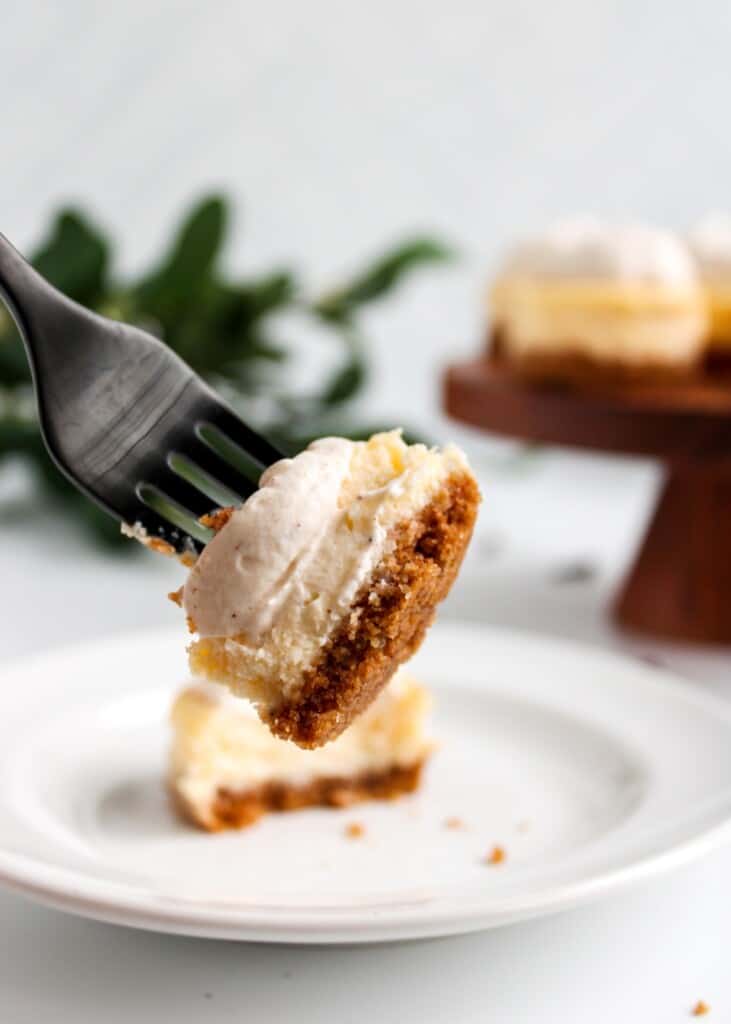 A fork showing a piece of Rompope Cheesecake Bite.