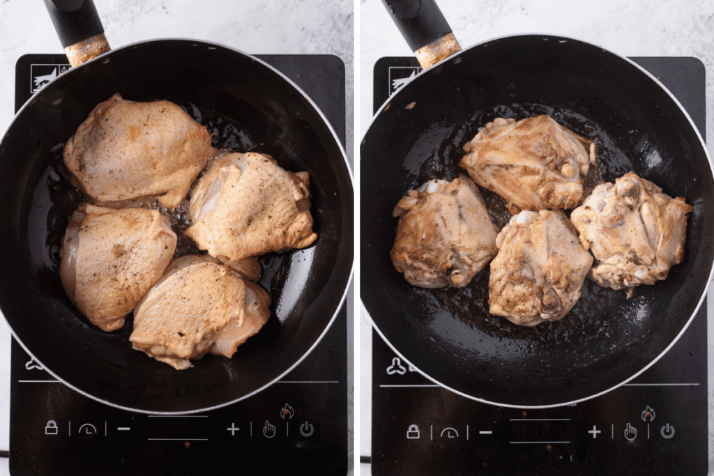 Searing the chicken thighs in a large black skillet.