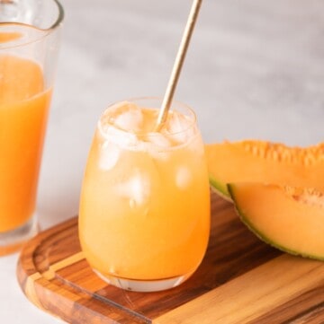 Agua de melon served on a glass with metal straw