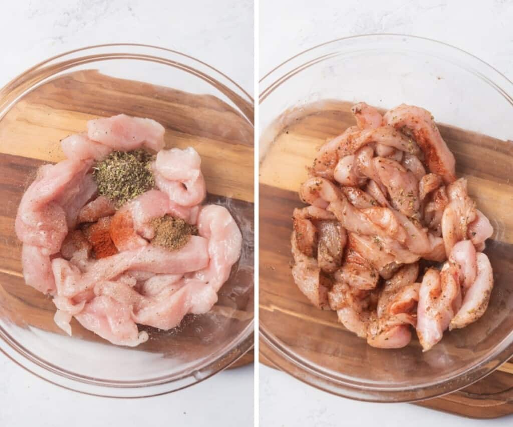 Seasoning raw chicken strips in a large glass bowl.