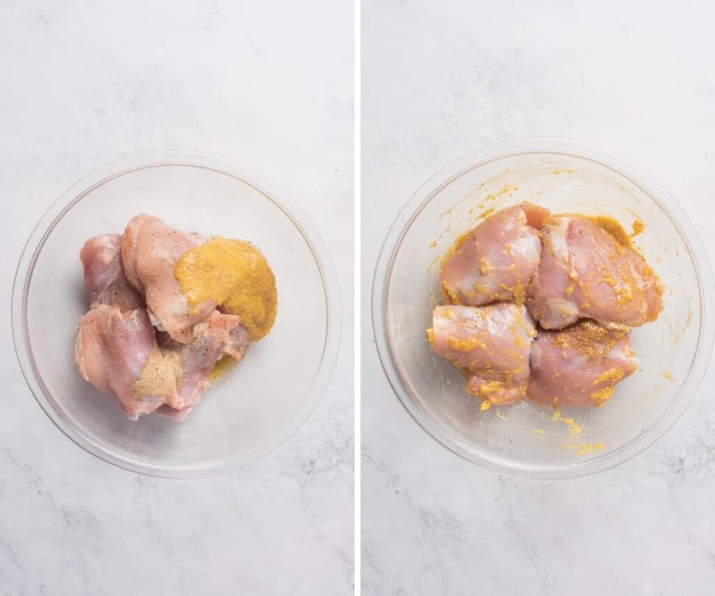Seasoning the raw chicken in a large glass bowl.