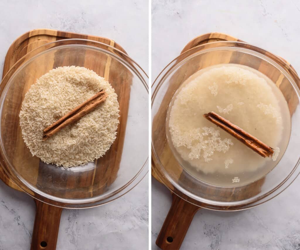 Rice soaking in a large glass bowl with a cinnamon stick.