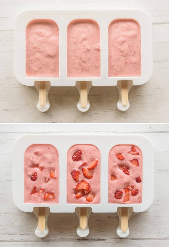 Assembling the strawberry popsicles in molds with wooden popsicle sticks.