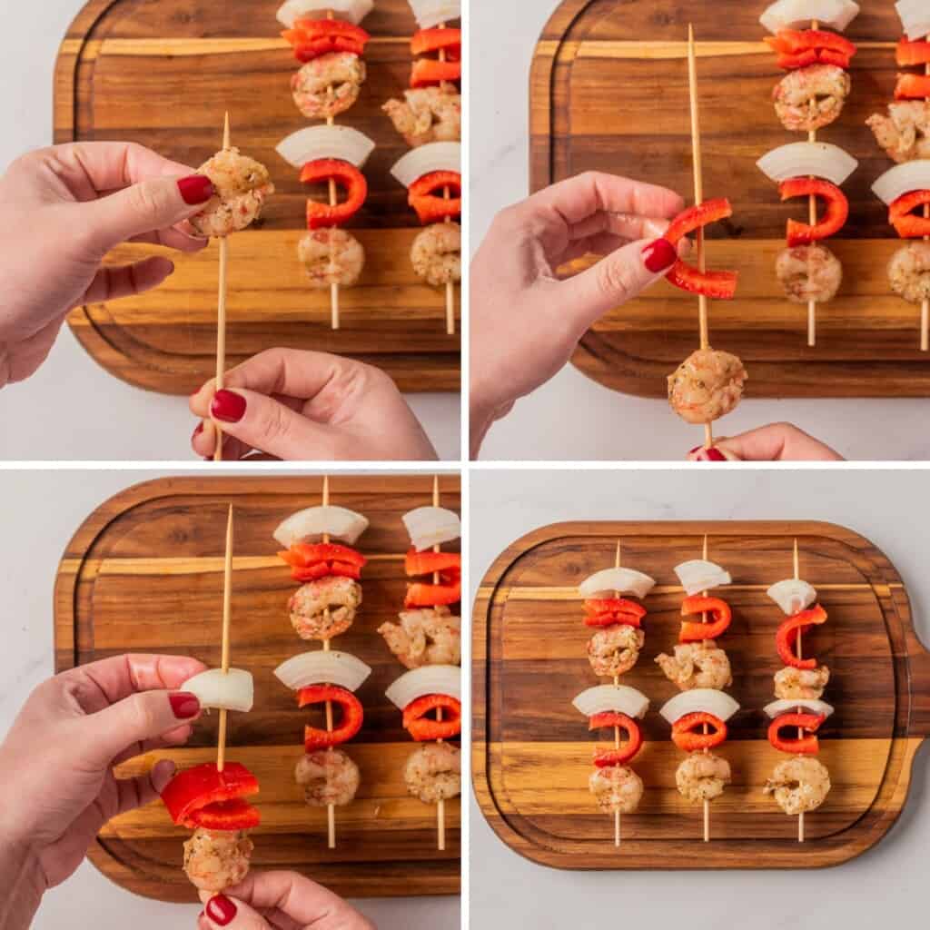 Assembling shrimp skewers on a wooden cutting board.