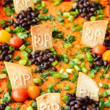 The Halloween Taco Dip served in a baking dip.
