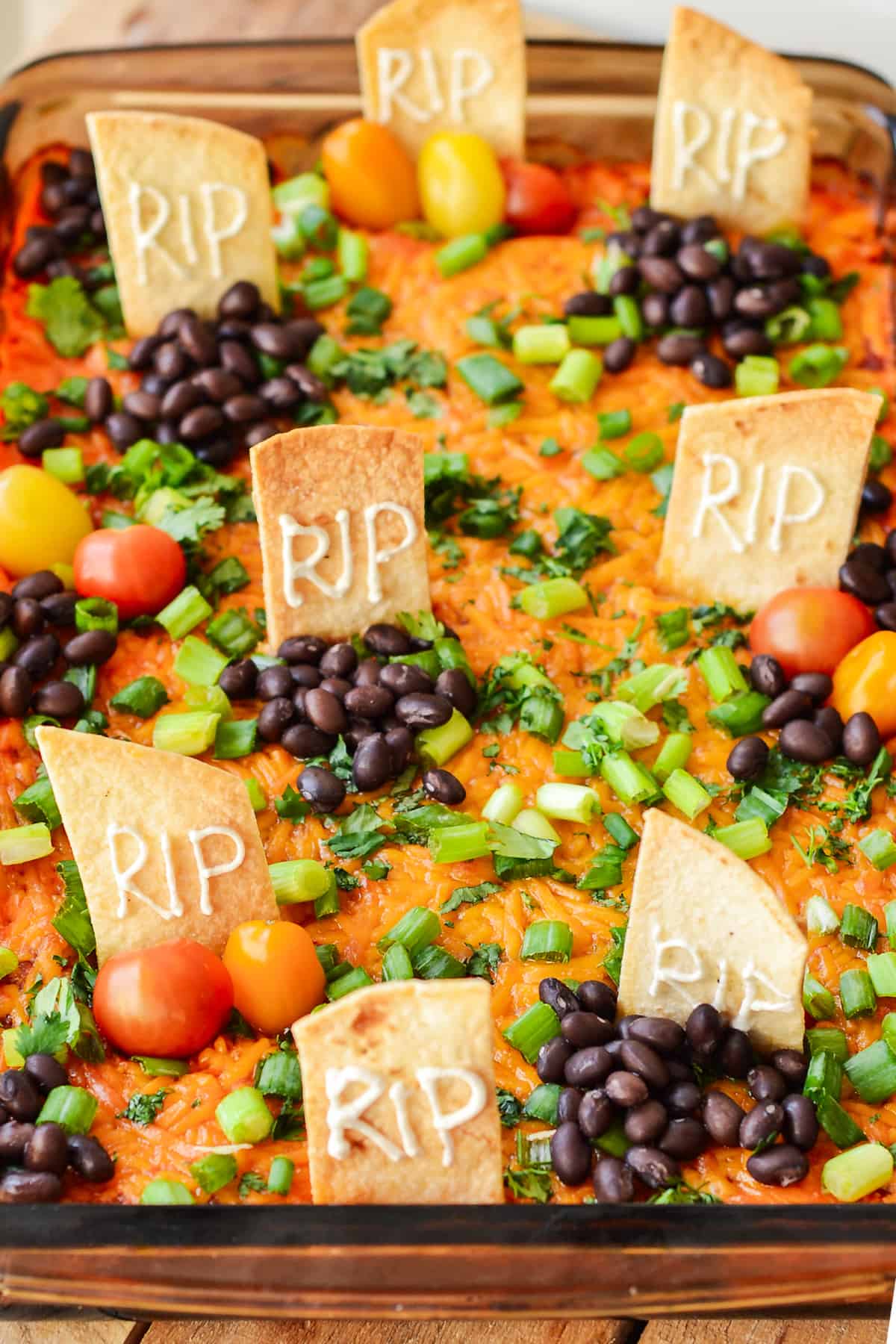 The Halloween Taco Dip served in a baking dip.