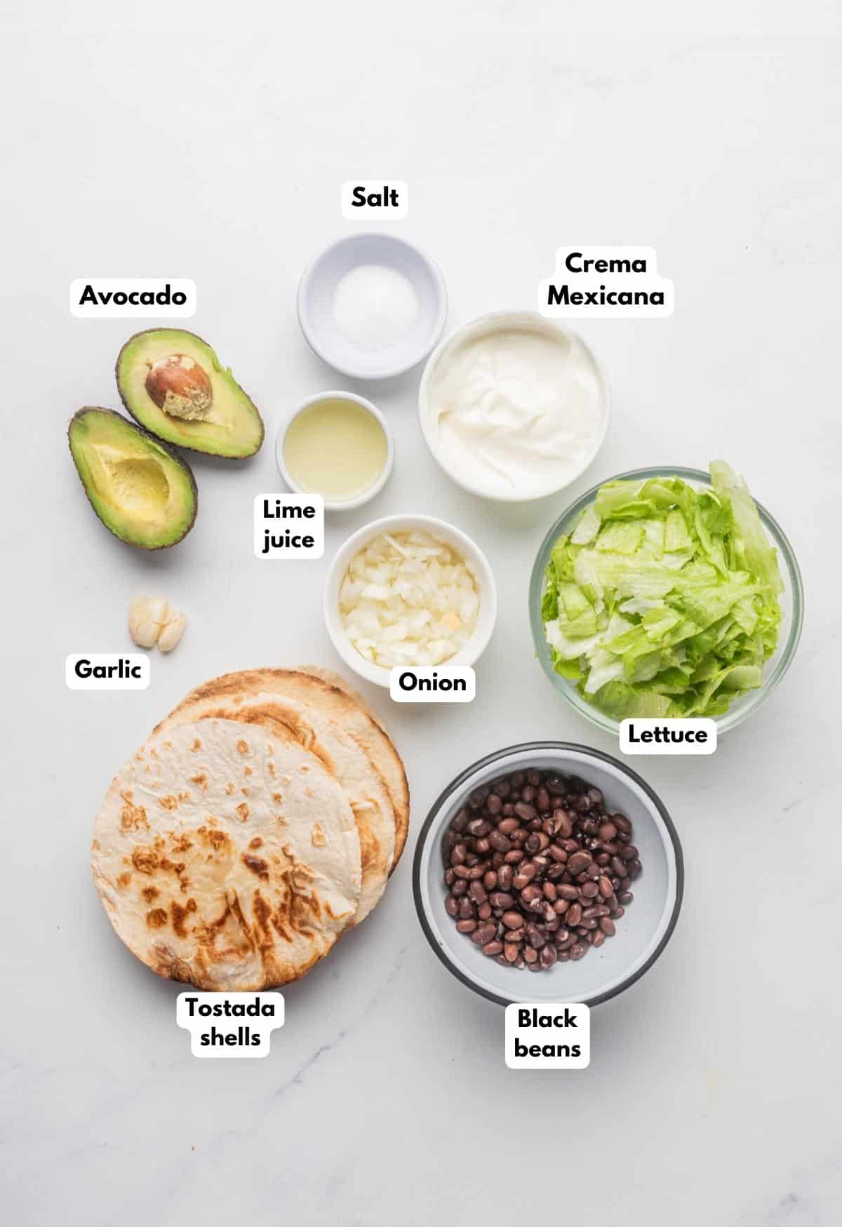 The ingredients needed to make guacamole tostadas.