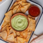 Mexican tortilla chips served with guacamole and salsa.