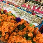 Marigolds and sugar skulls sold at a Mexican market.