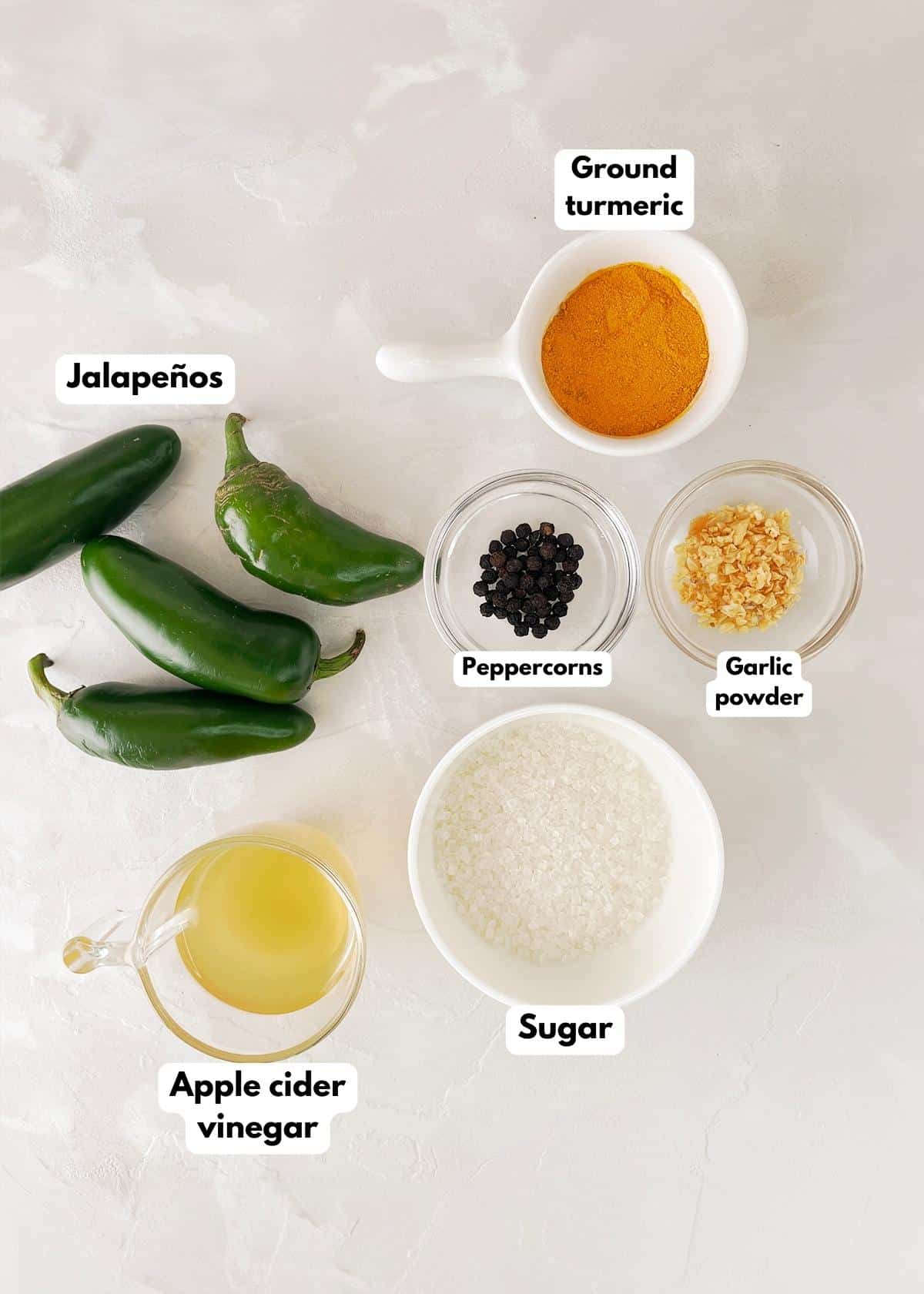 Ingredients to make sweet picked jalapenos.
