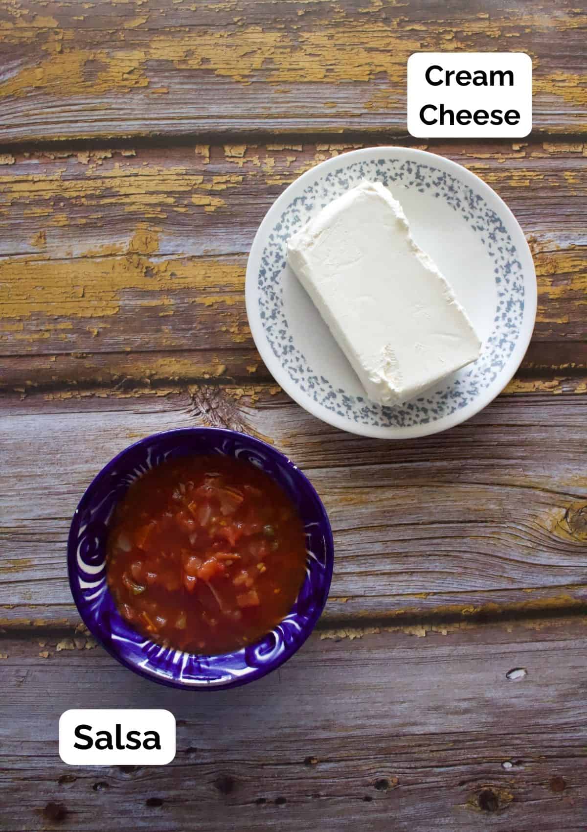 Cream cheese on a plate and salsa in a bowl sitting next to each other.