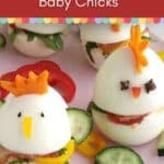 Two hard-boiled eggs decorated as Easter sandwich baby chicks with veggie beaks, eyes, and crests, sitting on cucumber slices. Text reads "Easter Sandwich Baby Chicks" and "Mama Maggie’s Kitchen.