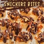 A plate of Frozen Banana Snickers Bites topped with caramel, chopped nuts, and drizzled with chocolate. Text on the image reads “Frozen Banana Snickers Bites” and “www.inmamamaggieskitchen.com.”.